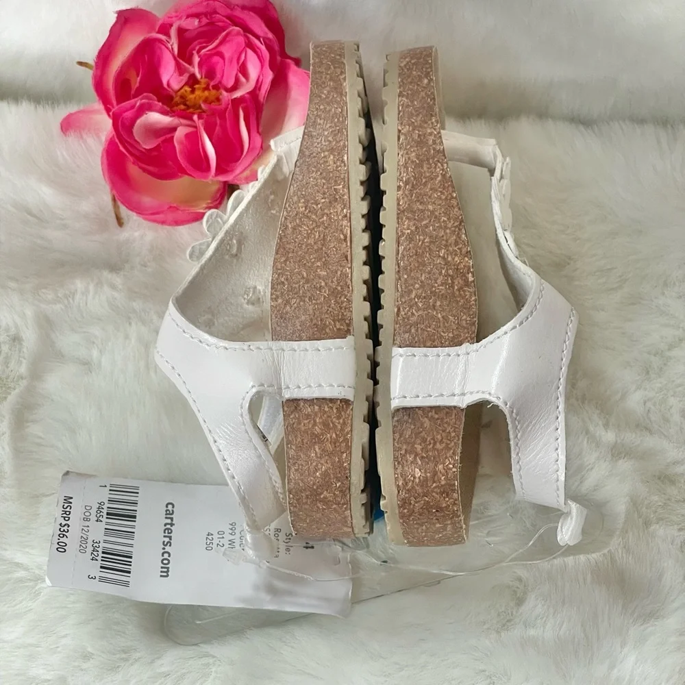 New with tags CARTER’S Toddler’s white Sandals with White Floral Design. Velcro